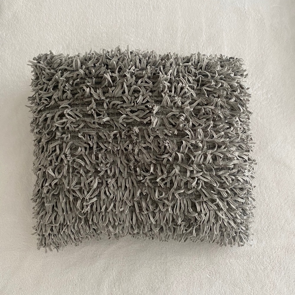 Fluffy gray throw pillow